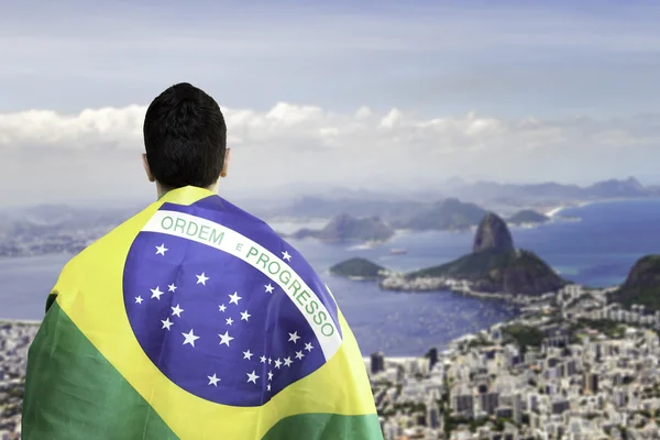 Man holding a brazilian flag in Rio de Janeiro