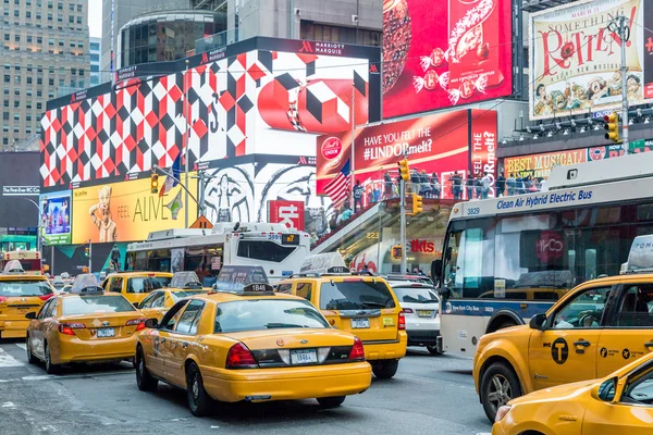 Vehicles move along Broadway in Times Square in New York City.