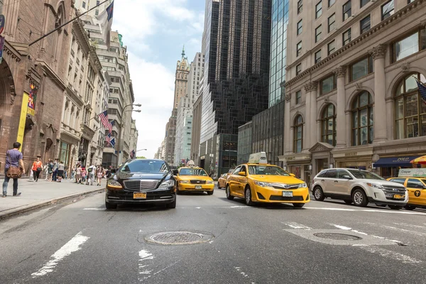 Vehicles move along 5th Avenue in New York City.