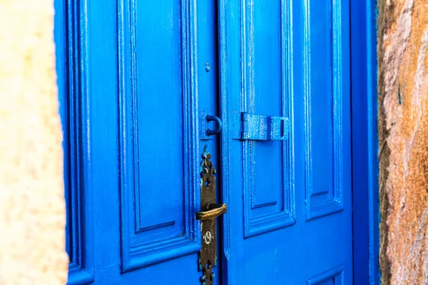 Antique blue door on the city of Ouro Preto, Minas Gerais, Brazil