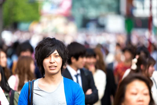 People walking at a busy street in Tokyo, Japan.