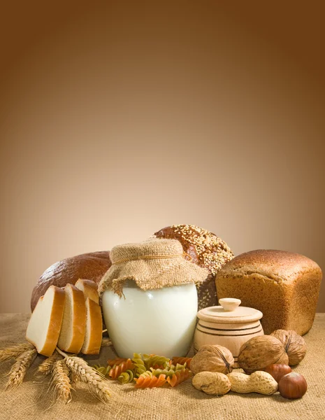 Mage of bread, nuts, wheat and dairy closeup