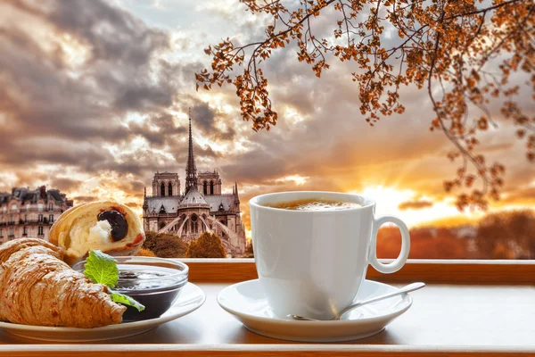 Breakfast Coffee and Croissant with beautiful sunrise