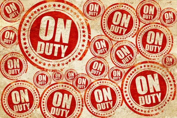 On duty, red stamp on a grunge paper texture