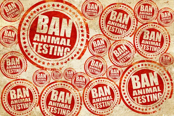 Ban animal testing, red stamp on a grunge paper texture