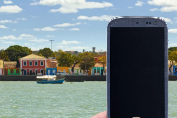 Porto Seguro coast and smartphone