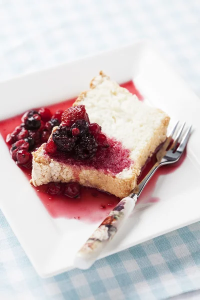 Angel food cake with sweet berry sauce