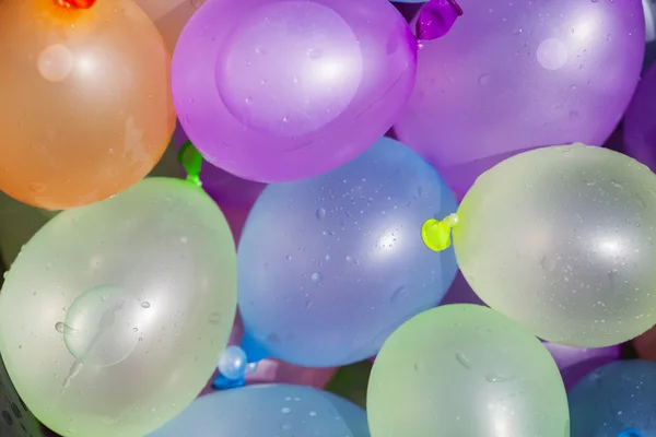 Summer fun concept: colorful water balloons, background