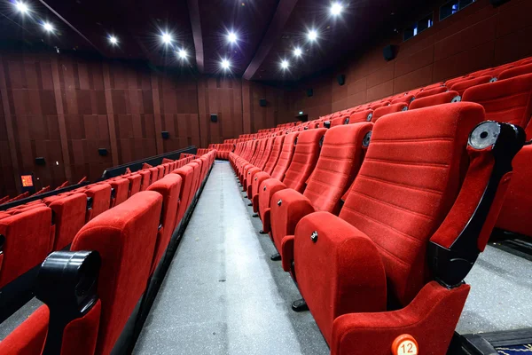 Empty movie theater with red seats