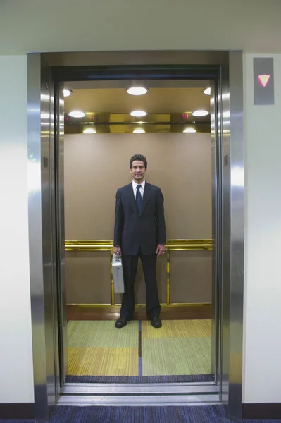 Businessman in elevator