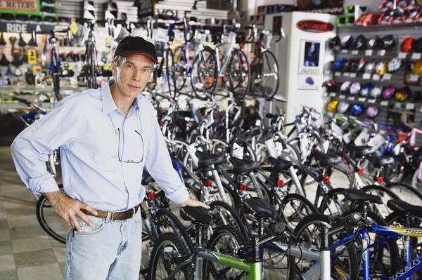 Man standing in bike shop