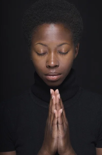African woman praying