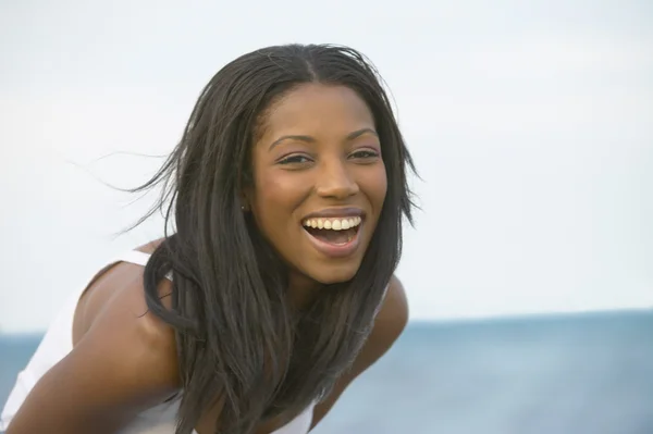 Young African woman laughing outdoors