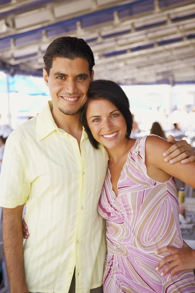 Young couple hugging outdoors