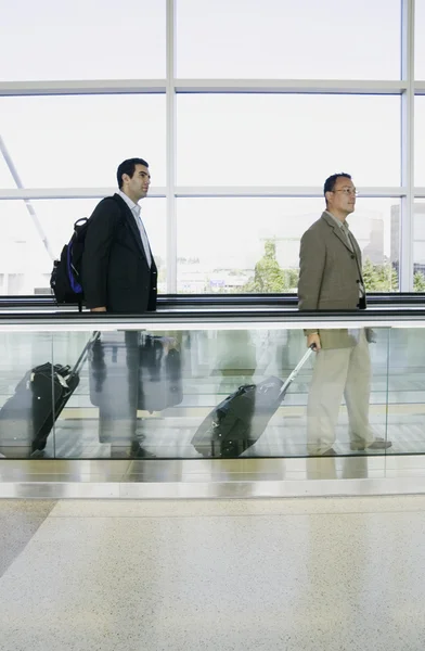 Men with luggage at airport