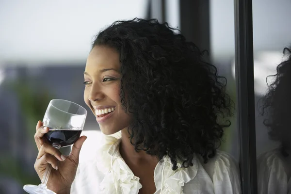 South American woman drinking wine