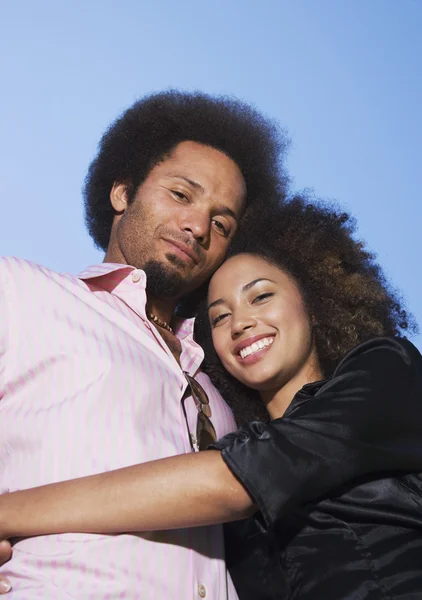 African couple hugging