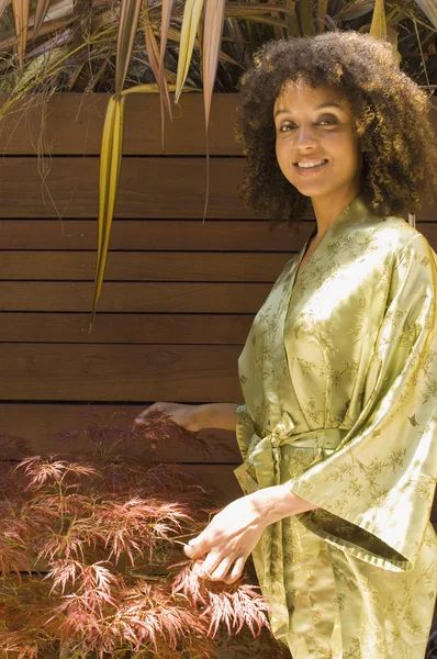 African American woman in silk robe
