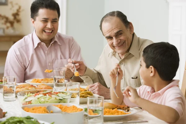 Hispanic family at dinner table