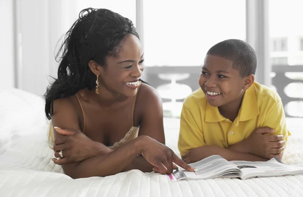 African American mother and son reading