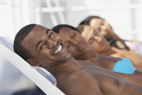 African American man sunbathing