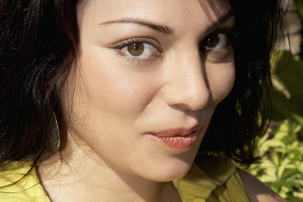 Hispanic woman pursing lips