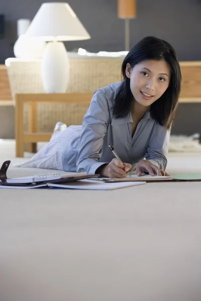 Asian businesswoman working on floor