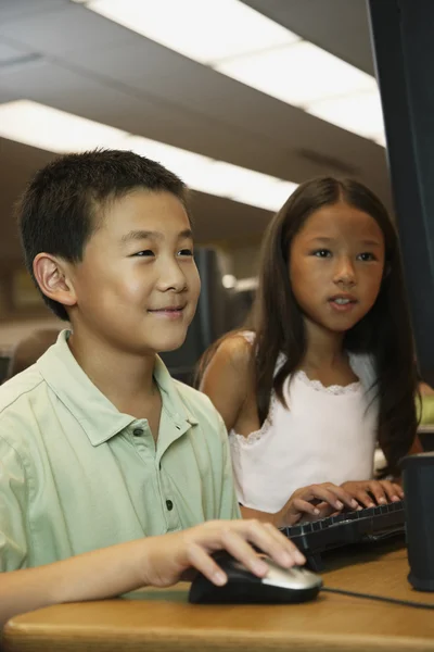 Asian students using school computer