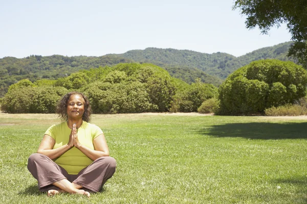 African American woman practicing yoga