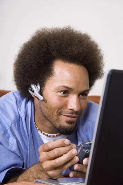 African man using electronic organizer