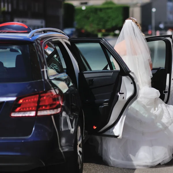 Bride and bridesmaid take a taxi
