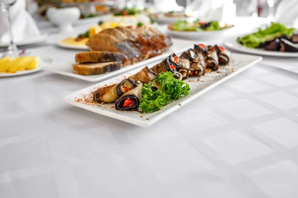 Banquet Table in restaurant served with different meals.