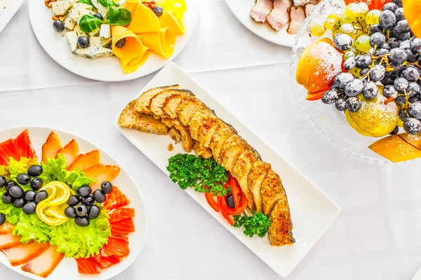 Banquet Table in restaurant served with different meals.