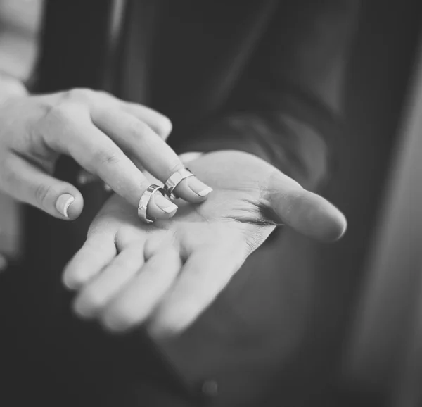 Newlywed couple and wedding rings.