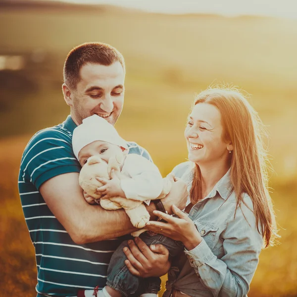 Happy family in sunset light.