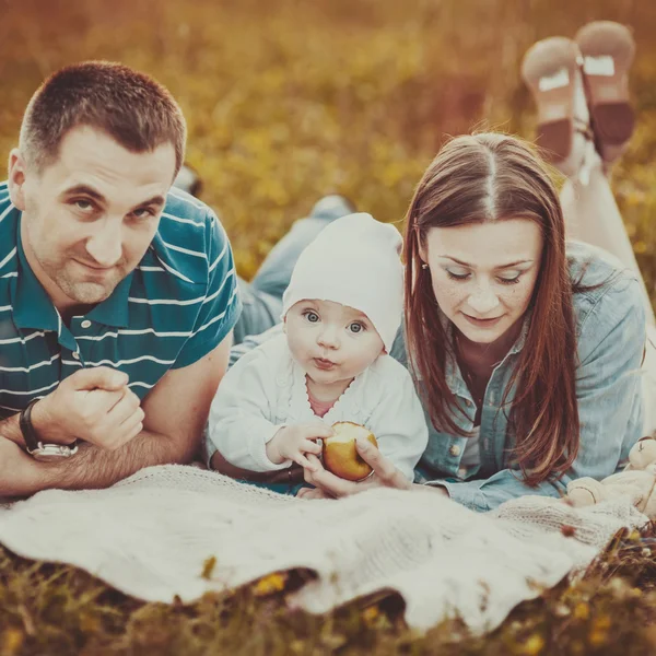 Happy family of mother father and daughter.