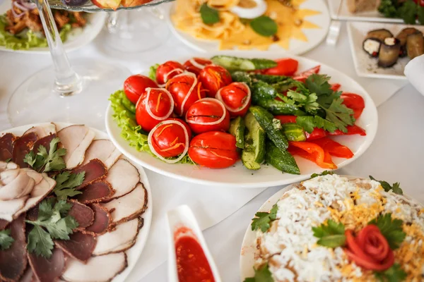 Mixed food on banquet table.