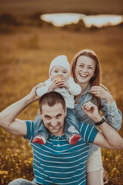 Happy family in sunset light.