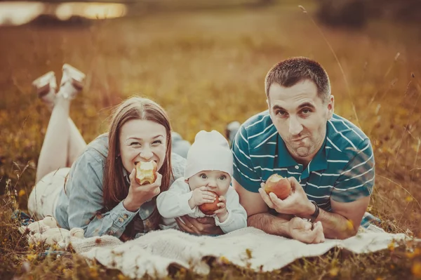 Happy family in sunset light.