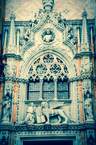 Doge and winged lion over the entry to Doge\'s Palace