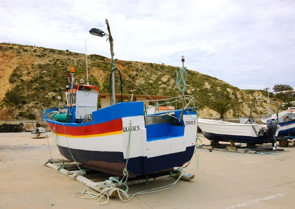 SAGRES, PORTUGAL - MAY 3, 2015: Fishing boats in dry dock in the port of Sagres in Algarve region. Fishing tours in the area are proposed to the tourists.