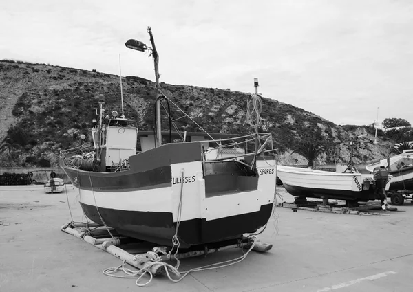 SAGRES, PORTUGAL - MAY 3, 2015: Fishing boats in dry dock in the port of Sagres in Algarve region. Fishing tours in the area are proposed to the tourists.