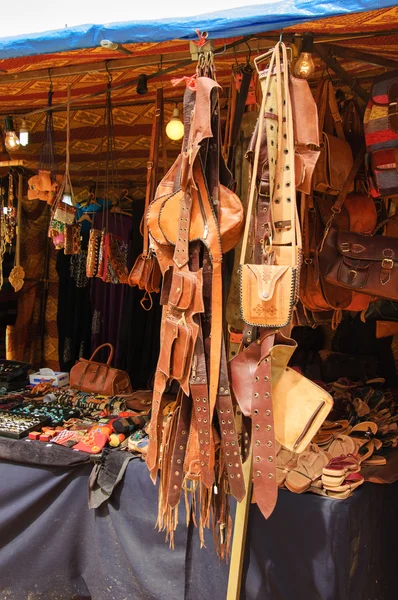 Leather accessories at the market in Portugal.