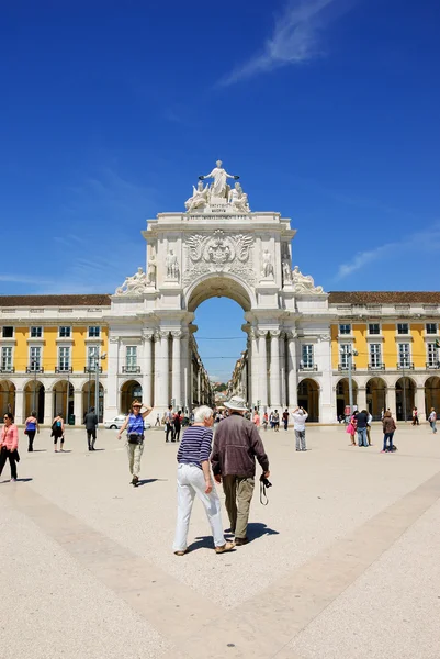 LISBON, PORTUGAL - APRIL 22, 2015: Senior tourists visiting the Commerce square (Praca do Comercio) and Rua Augusta Arch at background.