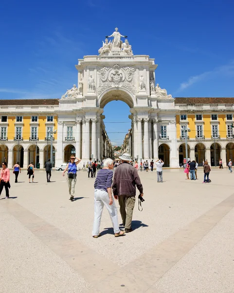 LISBON, PORTUGAL - APRIL 22, 2015: Senior tourists visiting the Commerce square (Praca do Comercio) and Rua Augusta Arch at background.