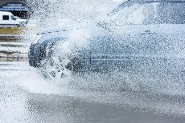 Car rain puddle splashing water