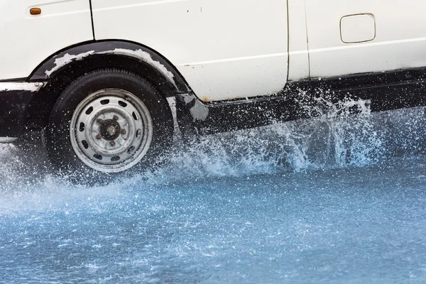 Car rain puddle splashing water