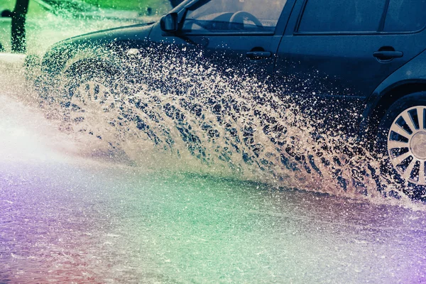 Car rain puddle splashing water