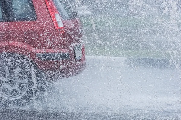 Car rain puddle splashing water