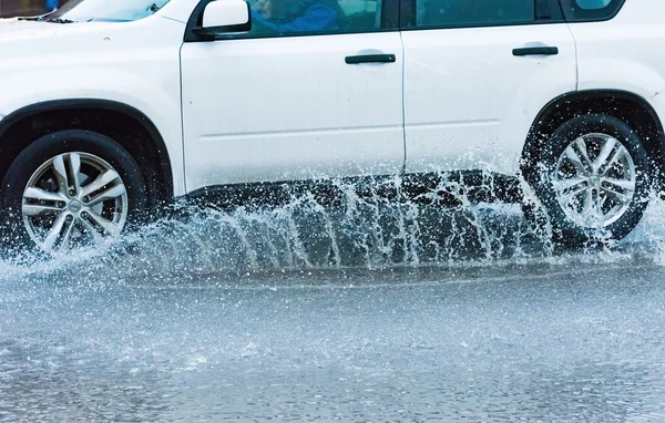 Car rain puddle splashing water